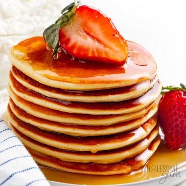 Stack of cottage cheese pancakes with syrup.