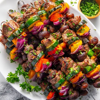 Shish kabobs on a plate.